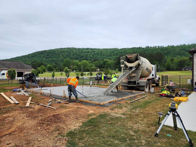 Crew pouring a concrete slab at a North Alabama home