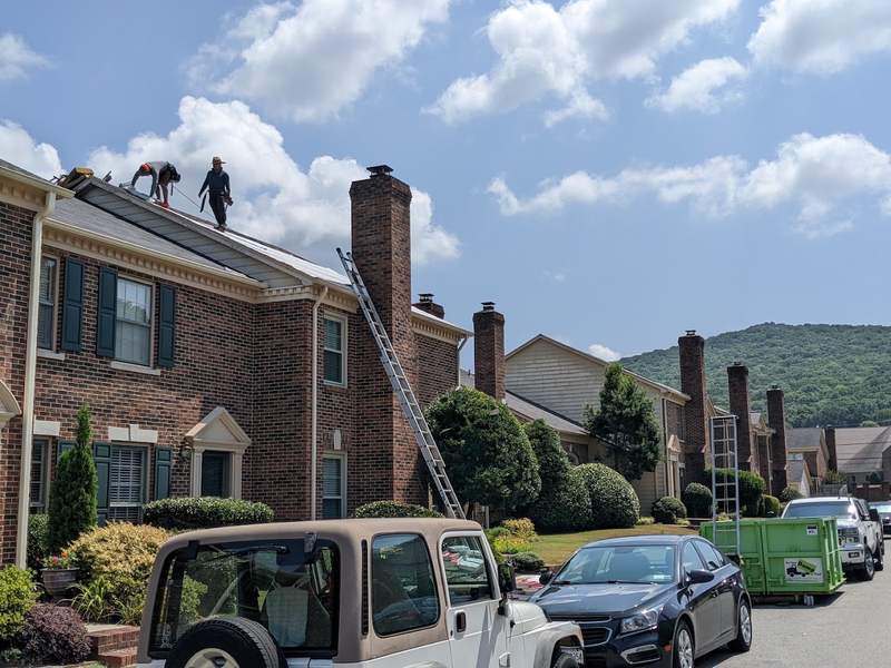Roofer working on a roof in Huntsville, AL