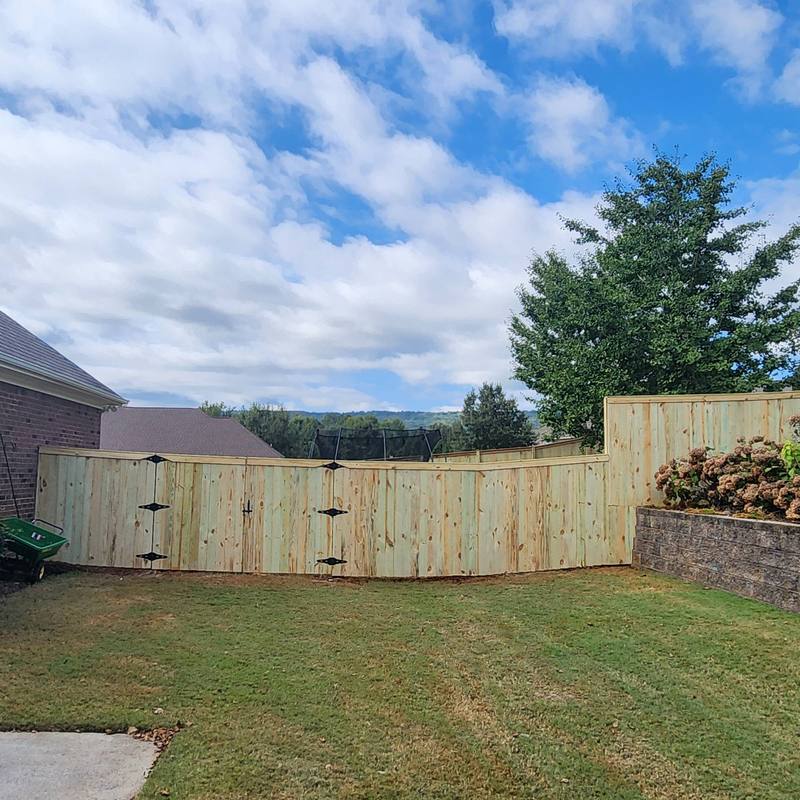 New wood privacy fence with double gates in Owens Cross Roads, AL