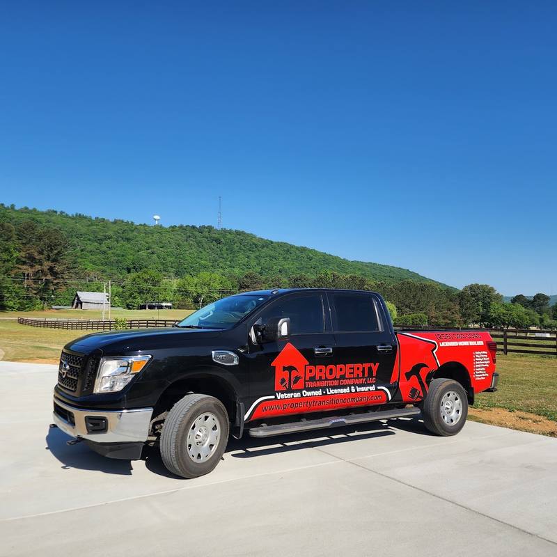 Property Transition Company, LLC work truck parked on a driveway